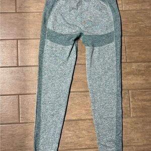 Gymshark women’s green leggings with high waisted band. Never worn.